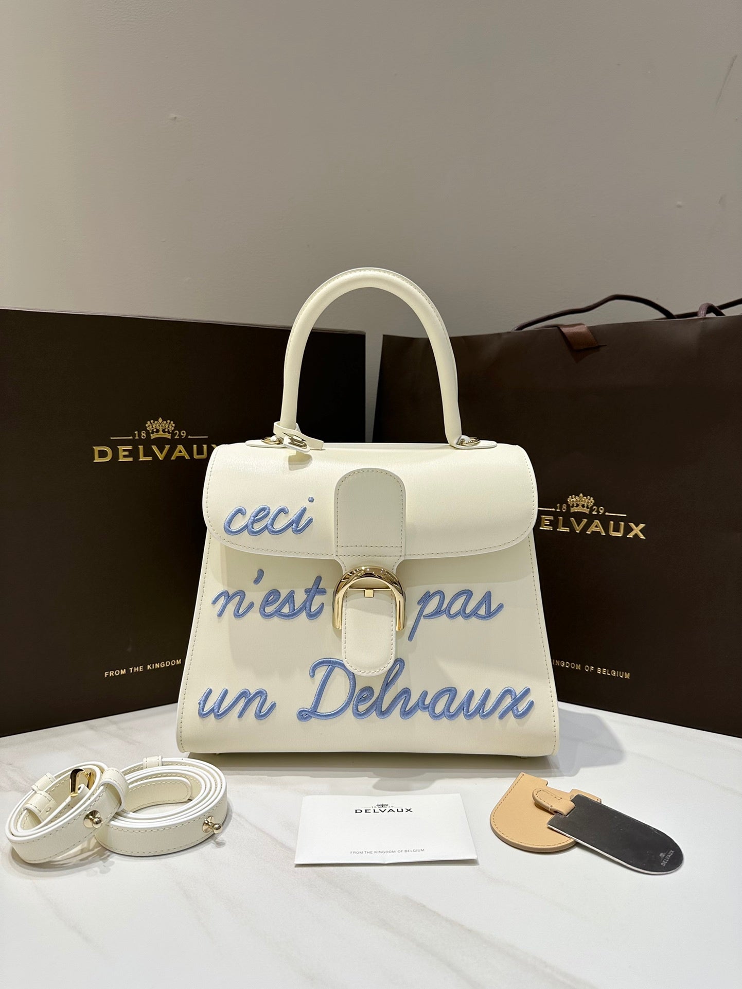Delvaux Brillant L'Humour Lettering Off-White / Blue